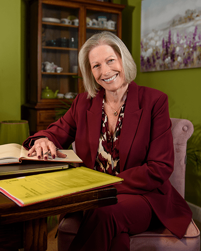 Annie Sitting at a Desk with a notebook